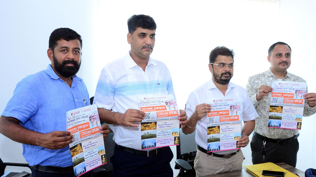 Mangaluru Smart City Limited (MSCL) Managing Director Mohammed Nazir, MCC Commissioner Ajith Kumar Hegde Shanady and others release a poster on 'Ease of Living Index 2019', in Mangaluru on Friday.