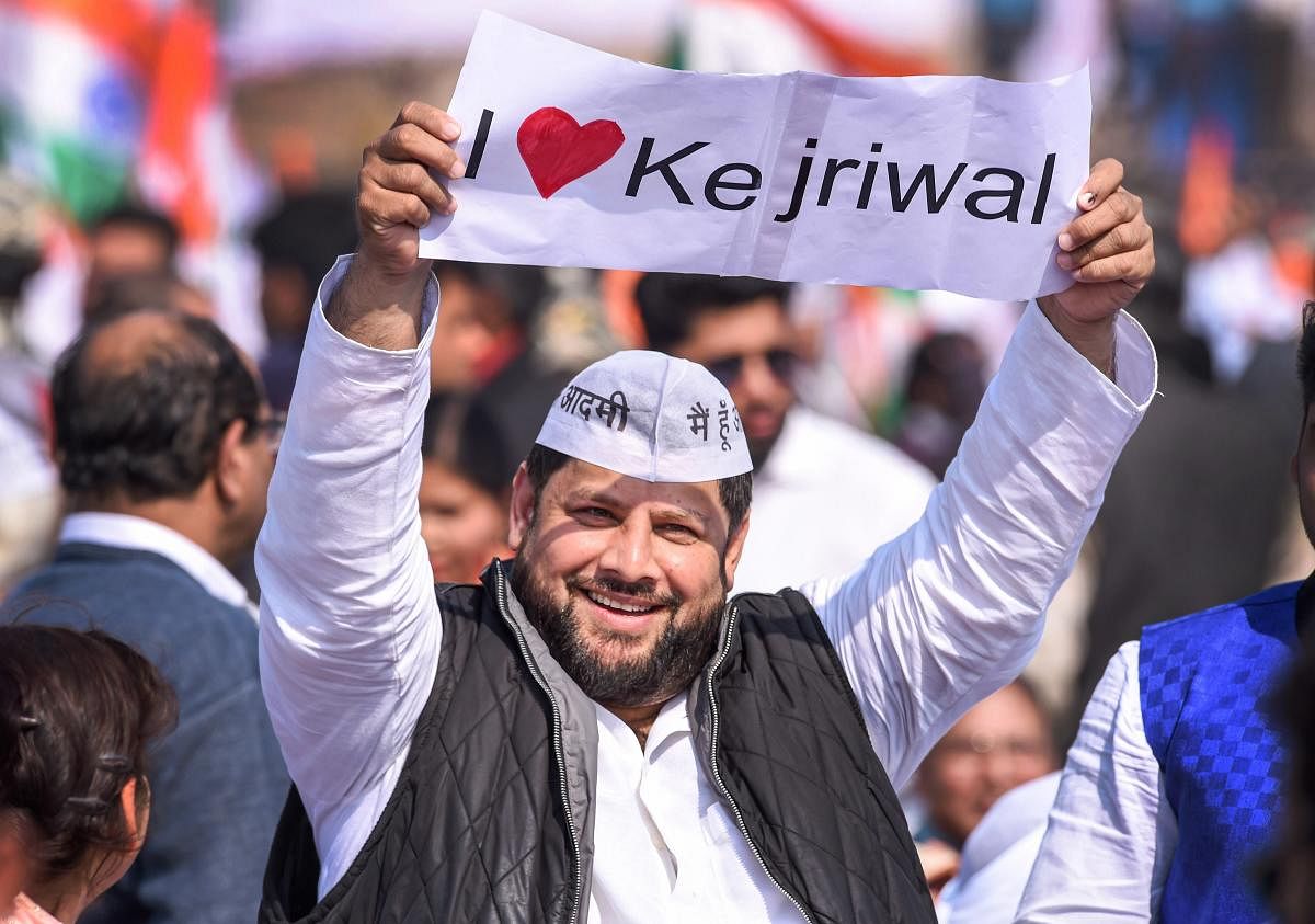 n AAP volunteer during Delhi Chief Minister Arvind Kejriwal's swearing-in ceremony at Ramlila Maidan in New Delhi. (PTI Photo)