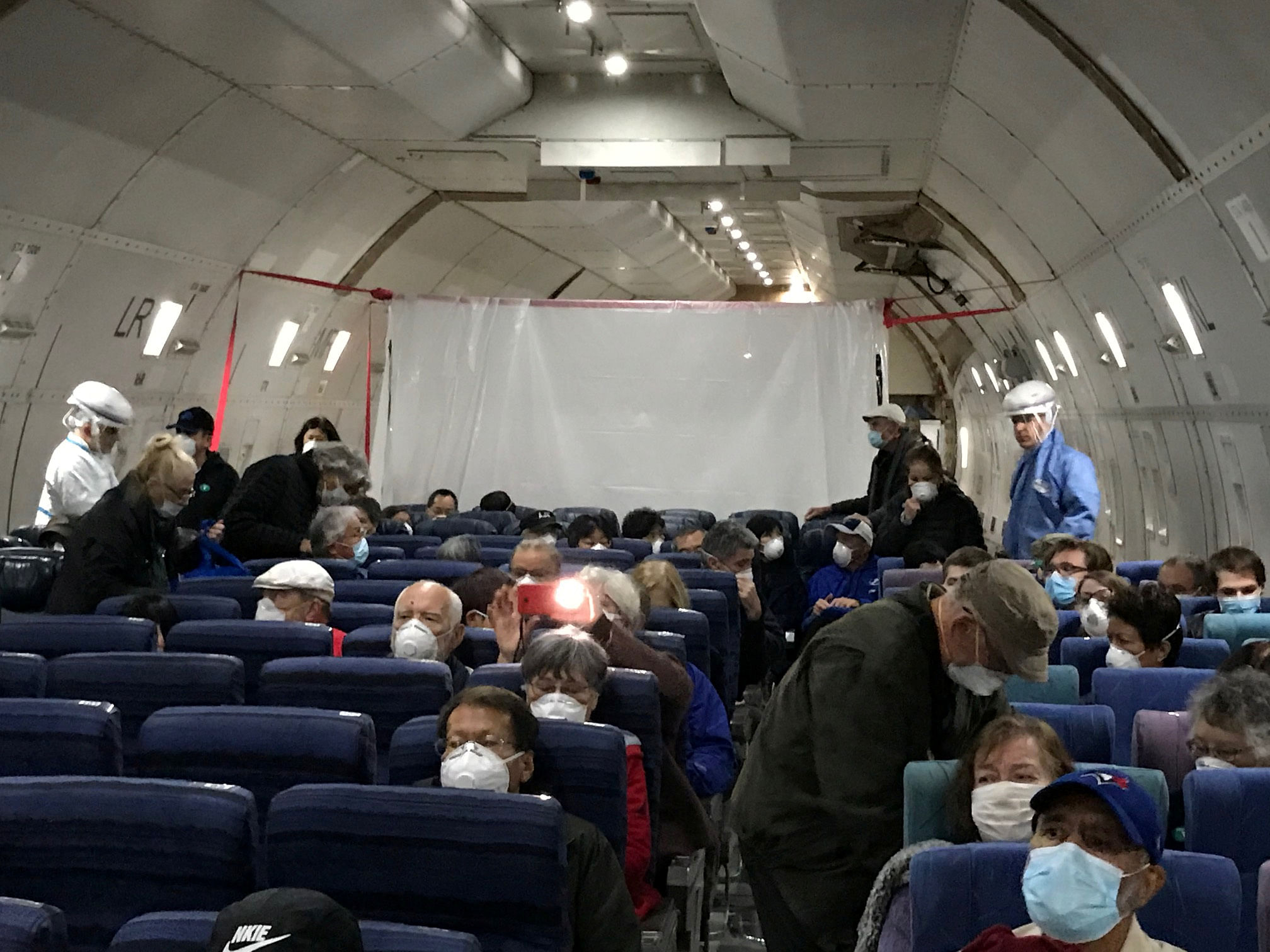 "During the flights, these individuals will continue to be isolated from the other passengers." (Credit: Reuters Photo)