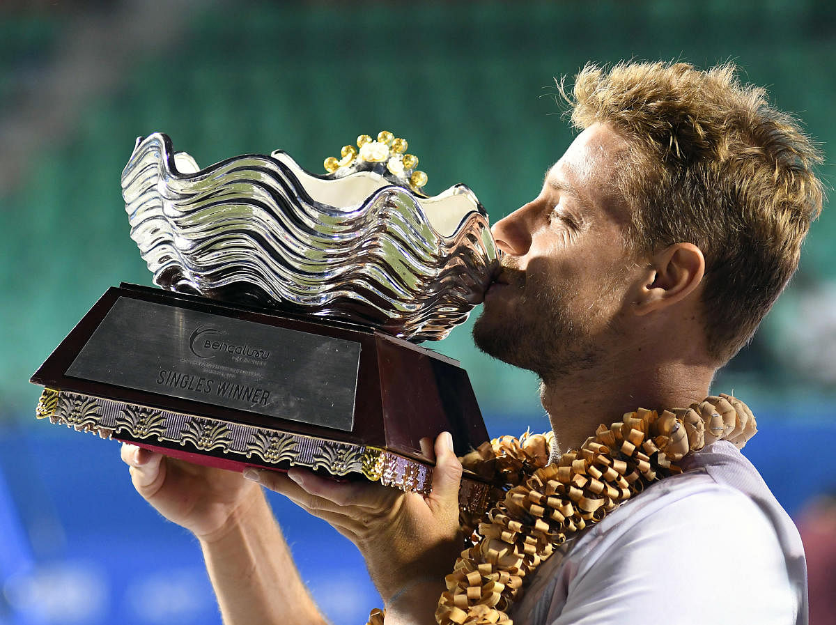 Bengaluru Open men’s singles champion James Duckworth of Australia kisses the trophy. DH PHOTOs/ PUSHKAR V