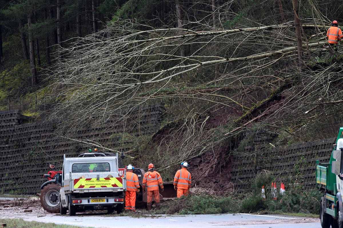 Highway maintenance staff clear a landslide blocking the A40 Brecon bypass following Storm Dennis, outside Brecon, Wales, Britain, February 17, 2020. (Reuters photo)