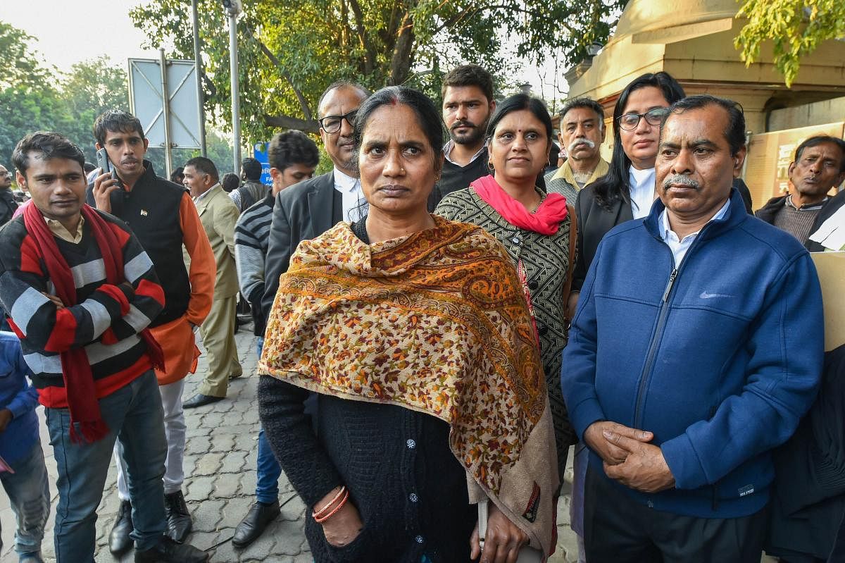  Nirbhaya rape and murder case victim's mother and father at the Patiala House Court, in New Delhi, Thursday, Feb. 13, 2020.