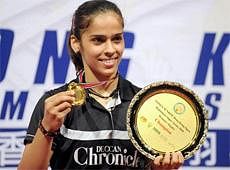 India's Saina Nehwal shows her gold medal she won in the women's singles final at the Hong Kong Open Badminton Super Series in Hong Kong Sunday, Dec. 12, 2010. AP