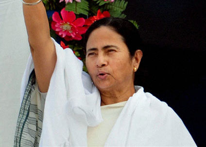 West Bengal Chief Minister Mamata Banerjee waves at crowd at a rally in Nadia district. PTI Photo