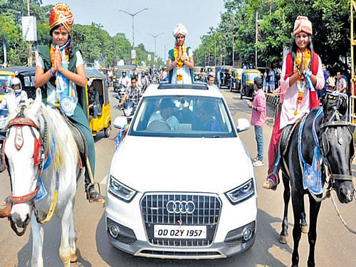 A candidate for the students union elections in a college in Odisha capital Bhubaneswar is heading for 'why I stand for' meeting in a luxurious car. DH Photo