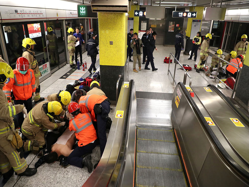 An injured person is given treatment inside a subway station in Hong Kong. Reuters