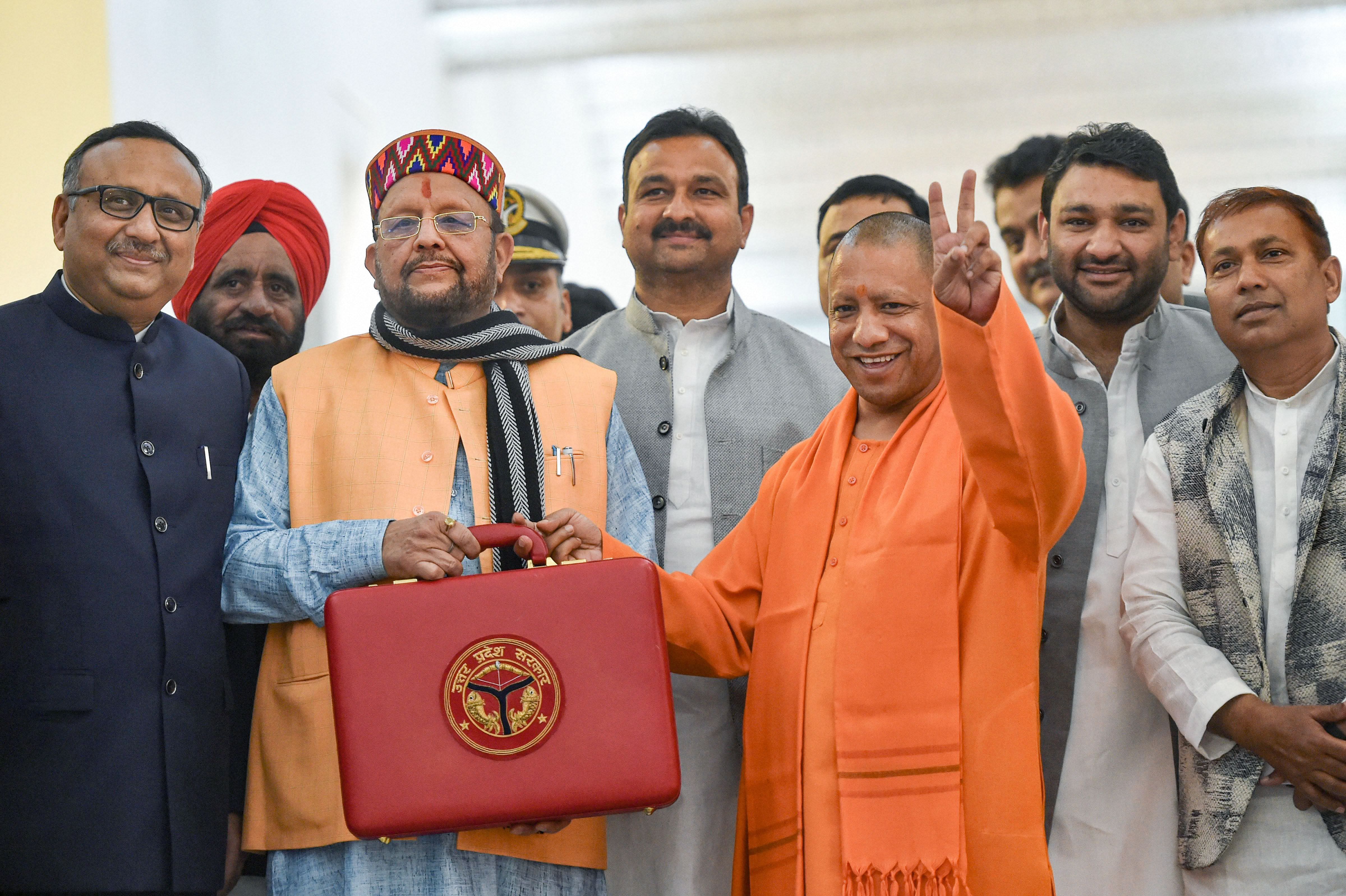 Uttar Pradesh Chief Minister Yogi Adityanath (R) and Finance Minister Suresh Khanna before the presentation of State Budget 2020-21 in the UP legislative assembly, in Lucknow. (PTI Photo)