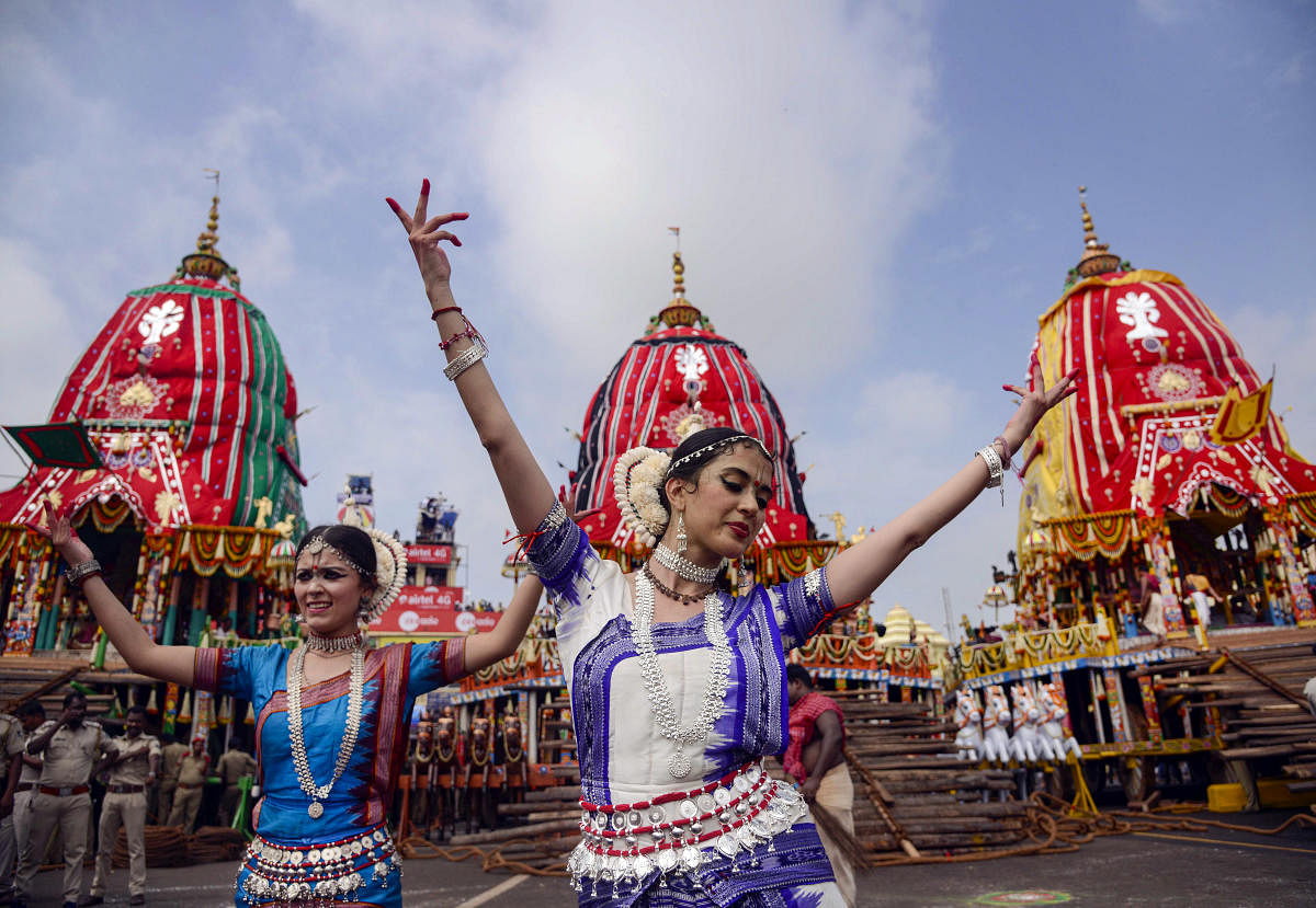 Devotees dance as they participate in the annual Rath Yatra, in Puri. (PTI Photo)