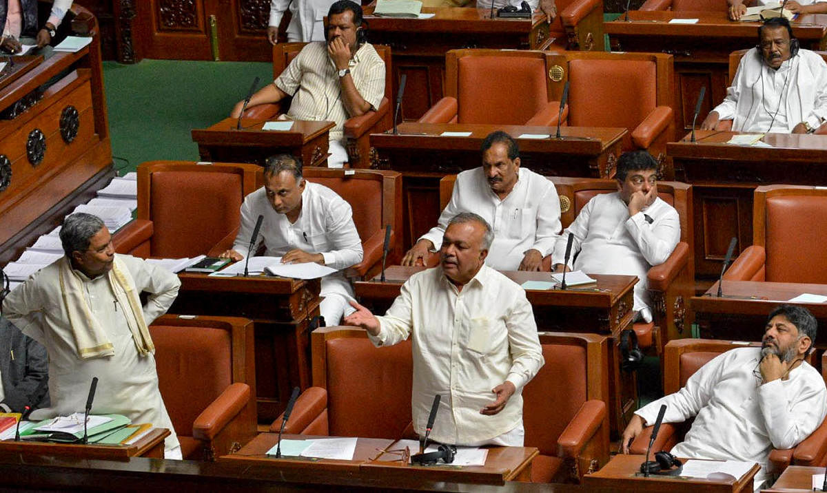 Leader of the Opposition Siddaramaiah and Congress member Ramalinga Reddy speak during the Assembly session at Vidhana Soudha in Bengaluru on Tuesday.