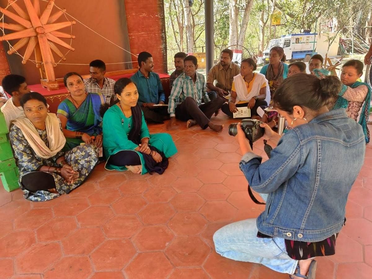 A student records video for a documentary film on Siddi tribals, during Bahuroopi theatre festival, on the premises of Rangayana in Mysuru on Tuesday.