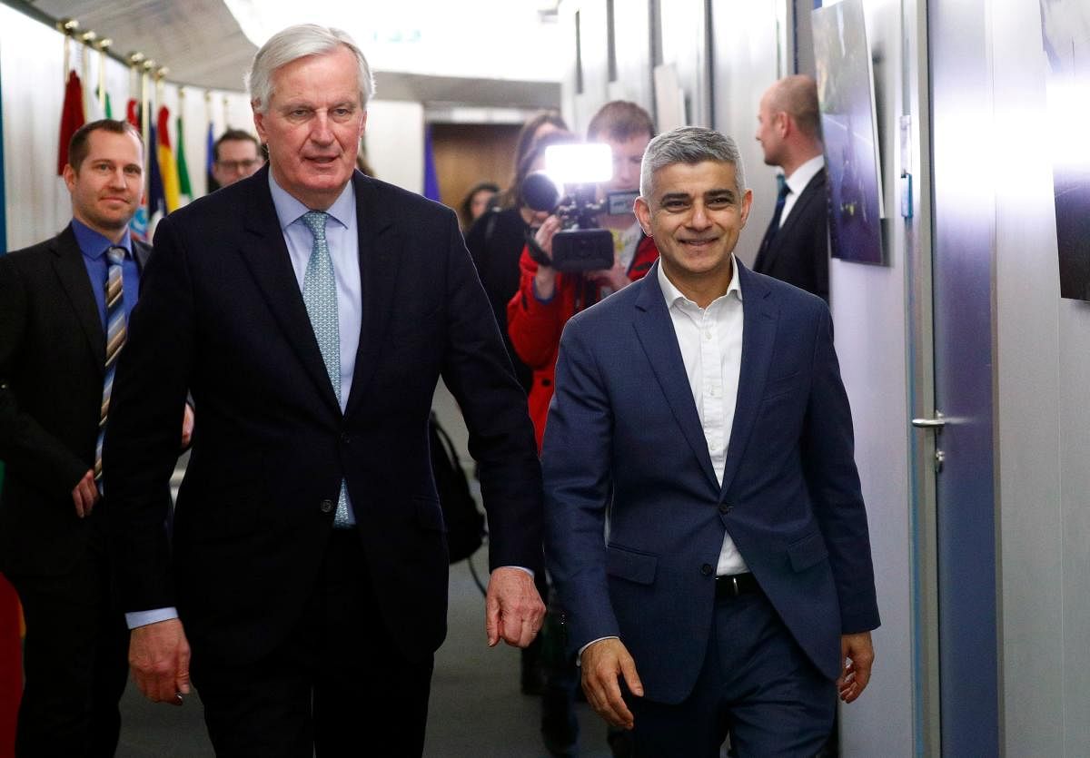 Michel Barnier, European Commission's Head of Task Force for Relations with the United Kingdom (L) walks next to Mayor of London Sadiq Khan at the EU Commission headquarters in Brussels, Belgium. AFP