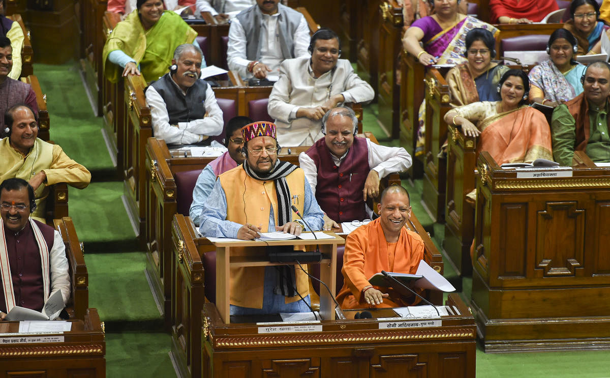 Uttar Pradesh Finance Minister Suresh Khanna presents the State Budget 2020-21 in the UP Legislative Assembly, in Lucknow, Tuesday, Feb18, 2020. Uttar Pradesh Chief Minister Yogi Adityanath is also seen. PTI