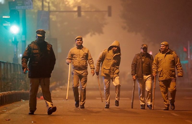 Police officers patrol after a protest against a new citizenship law in Delhi. (Reuters Photo)