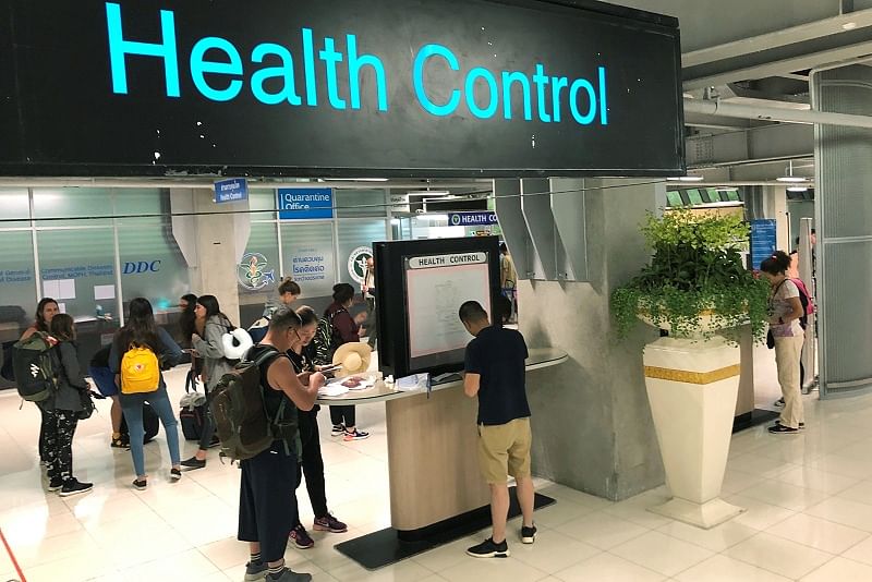 Tourist line-up in a health control at the arrival section at Suvarnabhumi international airport in Bangkok, Thailand. (Reuters Photo)