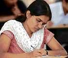 Scripting her future: A candidate writing the postgraduate entrance test, organised by  the RGUHS in Bangalore on Sunday. DH Photo