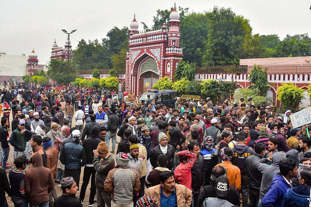 People gather at the Eidgah to protest against the alleged police action on AMU students. (PTI photo)