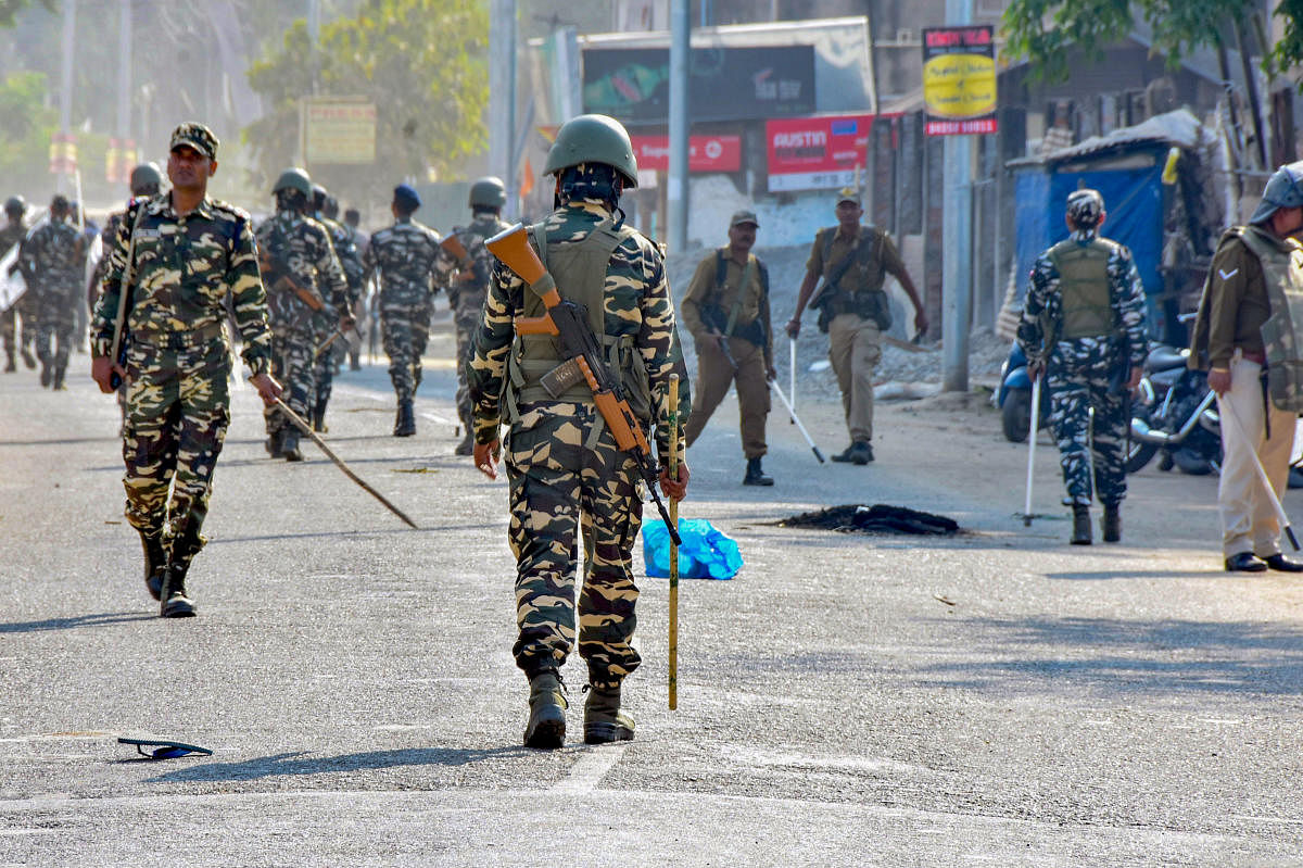 Security forces personnel patrol a street during curfew, imposed in view of various anti-CAB (Citizenship Amendment Bill) protests in Sonitpur, Assam. (PTI Photo)