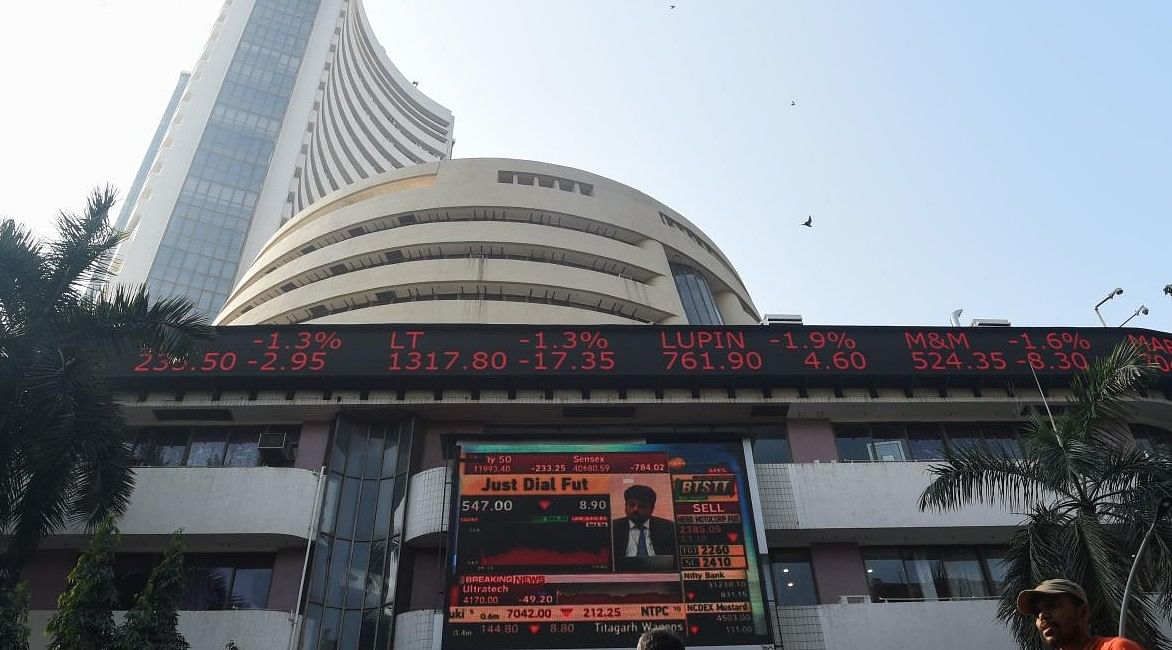 People walk past the Bombay Stock Exchange (BSE) in Mumbai on January 6, 2020.(Credit: AFP/ Punit PARANJPE )