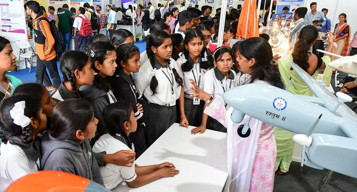 Children gathered around an UAV display unit at 107th Indian Science Congress, GKVK campus, Bengaluru (Credit: DH Photo/KRISHNAKUMAR P S)