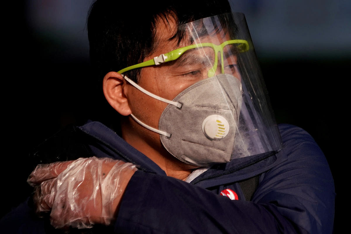 A man wearing a mask is seen at the Shanghai railway station in Shanghai. Reuters file photo