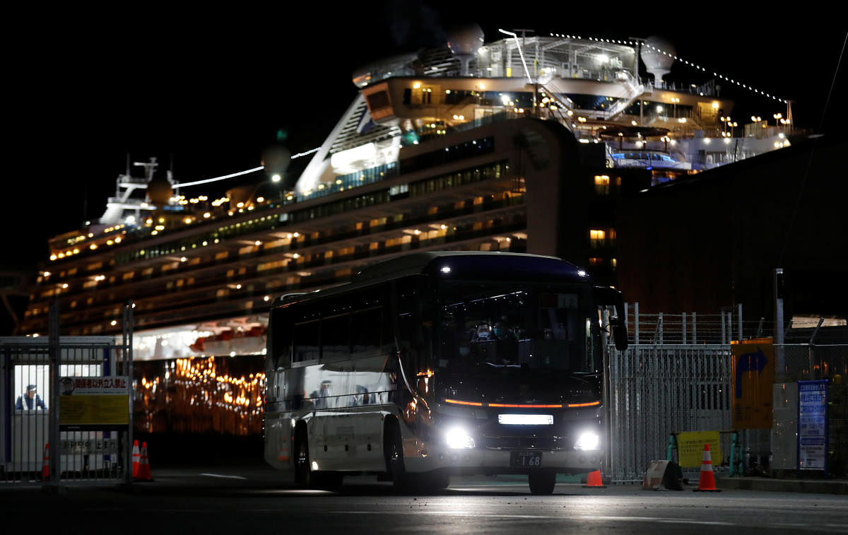 A bus believed to be carrying Hong Kong passengers from the cruise ship Diamond Princess, leaves Daikoku Pier Cruise Terminal in Yokohama. Credit: Reuters Photo