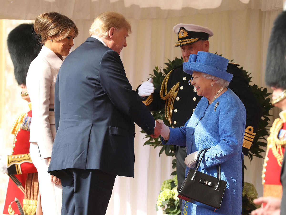 Britain's Queen Elizabeth greets U.S. President Donald Trump and First Lady Melania Trump, at Windsor Castle, Windsor, Britain July 13, 2018. (Chris Jackson/Pool via REUTERS)