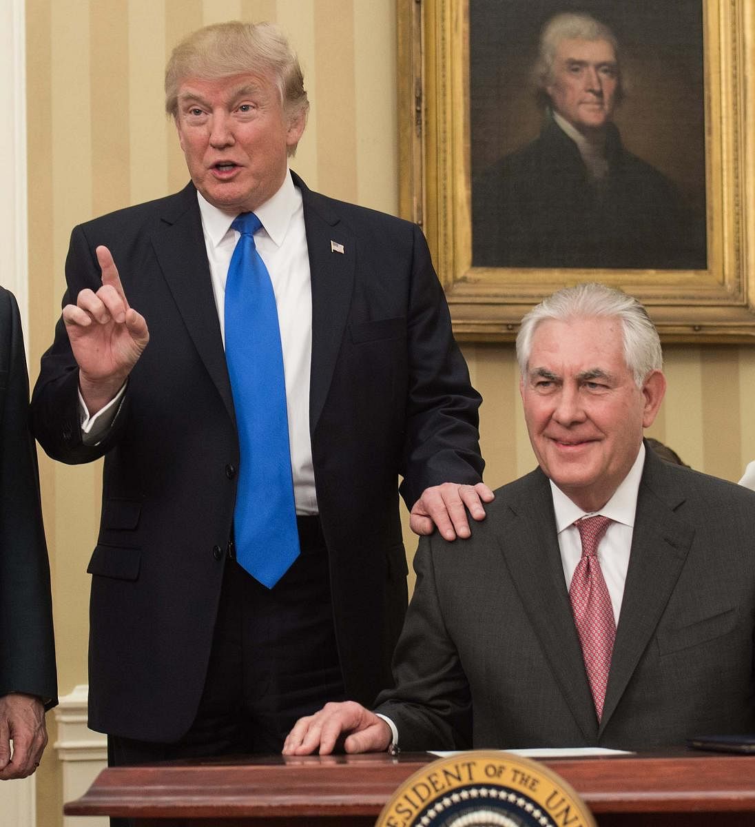(FILES) In this file photo taken on February 1, 2017, US President Donald Trump (L) speaks after Rex Tillerson was sworn in as Secretary of State in the Oval Office at the White House in Washington, DC. - Trump on December 7, 2018, called his former secre