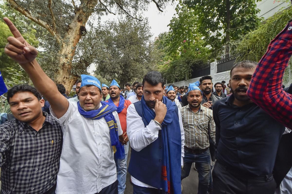 Bhim Army chief Chandrashekhar Azad, in solidarity with Jawaharlal Nehru University students, protests against the hostel and mess fee hike, in New Delhi, Satuday, Nov. 23, 2019. (PTI Photo)