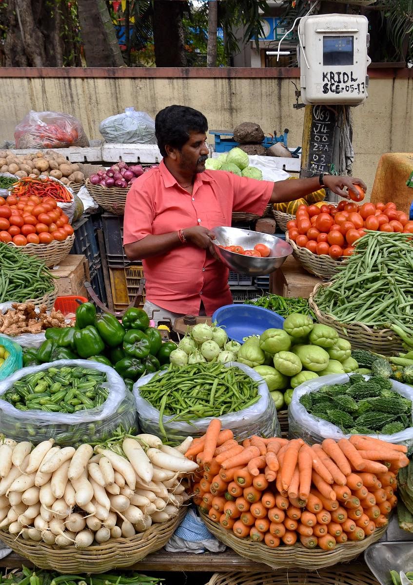 Potatoes, onions and green chillies are getting costlier in city markets than what their prices were before the protests began. Photo/AFP