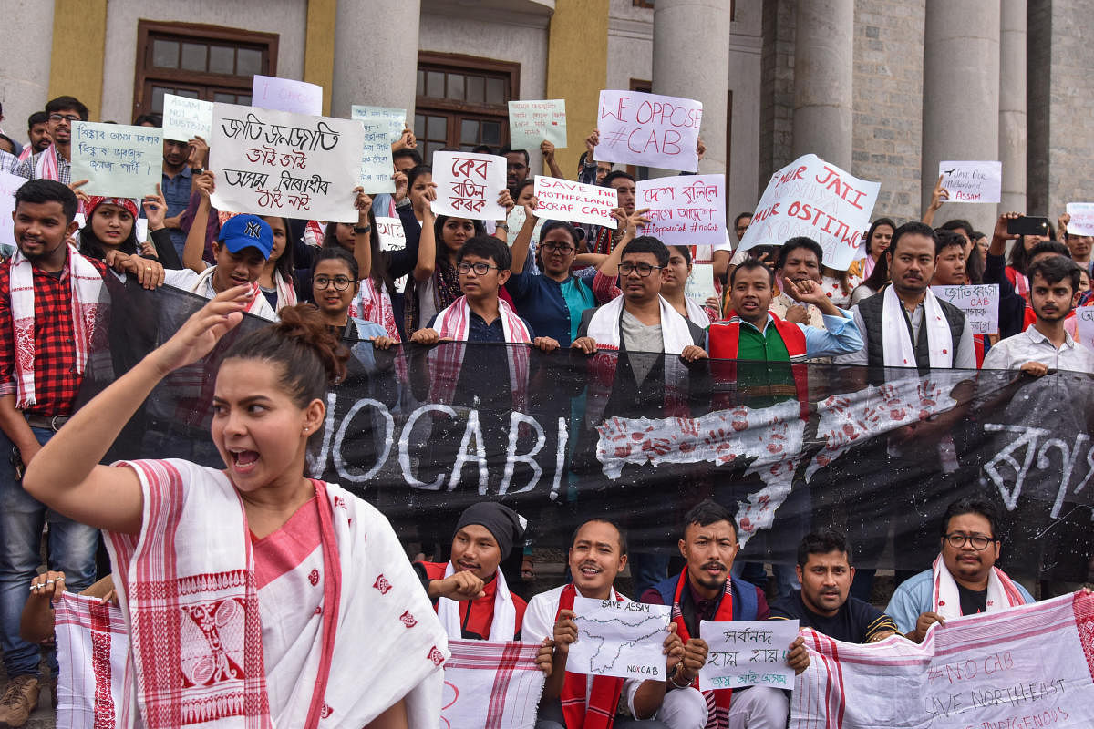 Students and members of Assam Society Bengaluru held a protest against Citizen (Amendment) Bill (CAB), in front of Town Hall in Bengaluru on Saturday. (Photo by S K Dinesh)