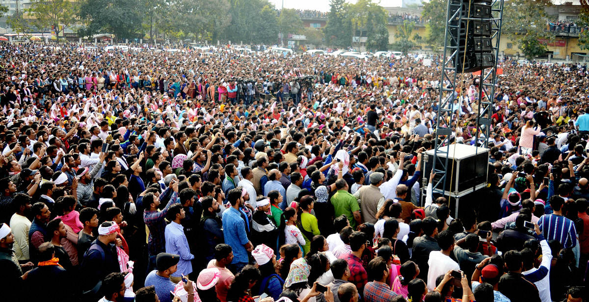 Protestors gather for a concert organised by All Artists of Assam against Citizenship Amendment Act, at AEI playground in Guwahati, Sunday, Dec. 15, 2019. (PTI Photo)