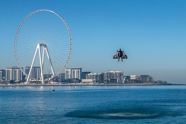 A handout picture released by the Expo 2020 on February 17, 2020, shows Vince Reffet, known as Jetman, taking part in a flight in the Emirati city of Dubai. (AFP Photo)