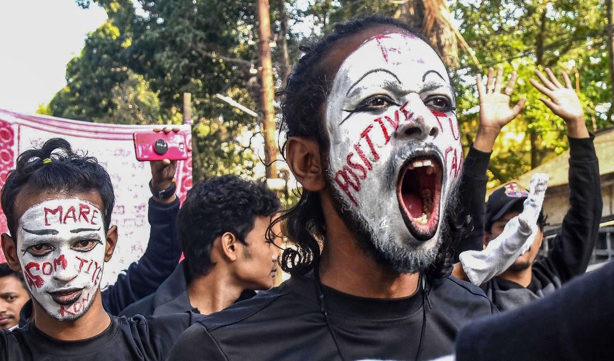 Students with hearing and vocal challenges take part in a protest against Citizenship Amendment Act in Guwahati. (PTI Photo)