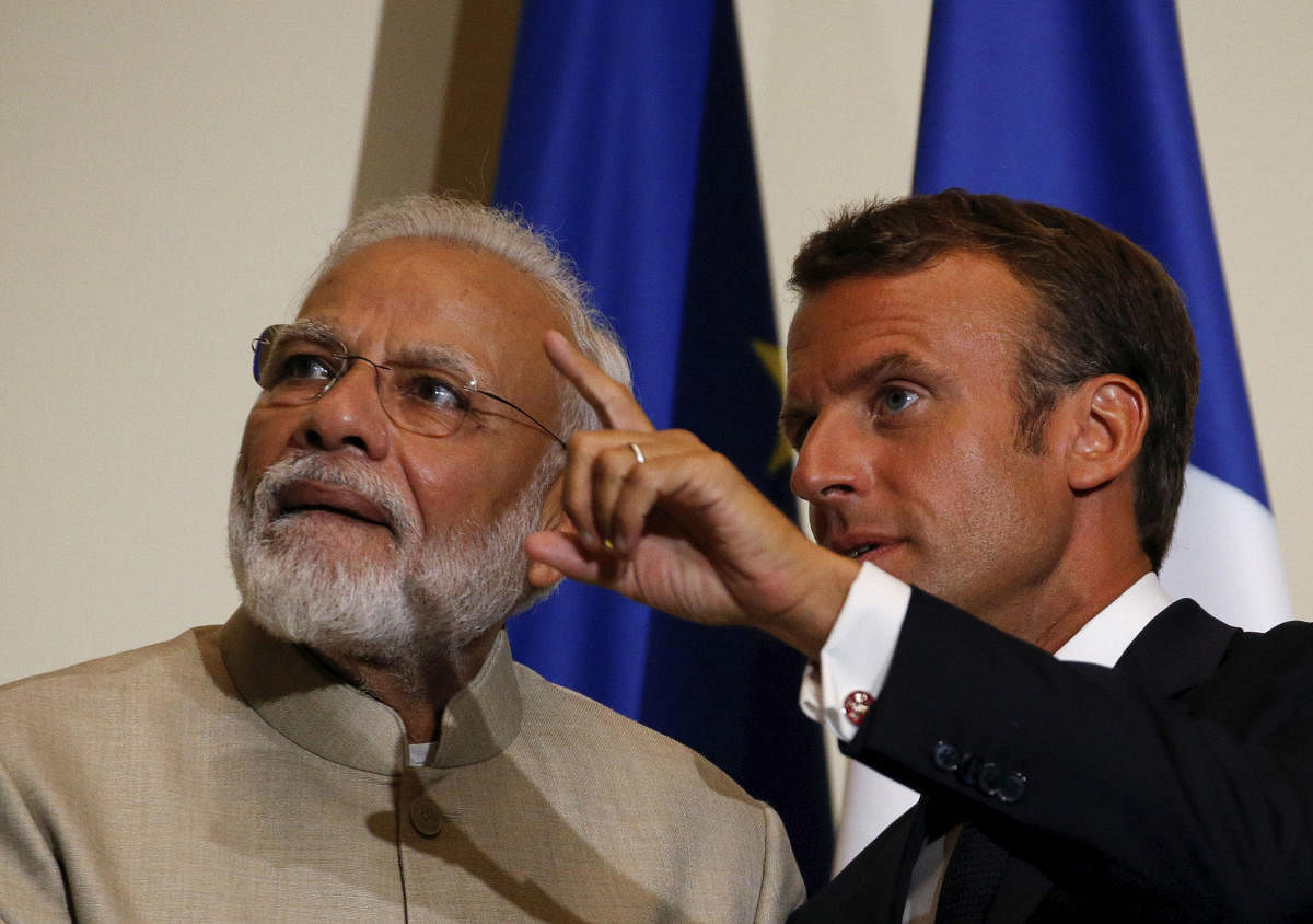 French President Emmanuel Macron with Prime Minister Narendra Modi. (AP/PTI photo)