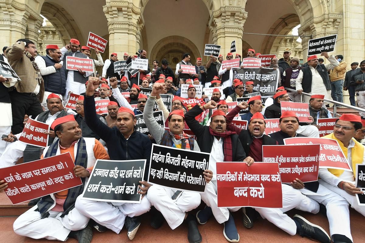 Lucknow: Samajwadi Party leaders protest against Citizenship Amendment Act (CAA) at Vidhan Sabha premises, in Lucknow, Thursday, Dec. 19, 2019. (PTI Photo/ Nand Kumar)