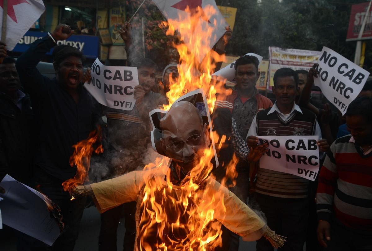 In West Bengal, where the Trinamool Congress government has been opposing the Citizenship( Amendment) Bill, arson by protesters was reported from various areas. Photo/AFP