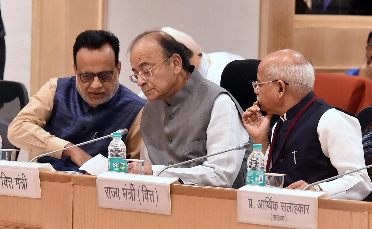 Finance Minister Arun Jaitley flanked by MoS for Finance Shiv Pratap Shukla (right) and Revenue Secretary Hasmukh Adhia at the 26th meeting of the GST Council, in New Delhi on March 10. PTI