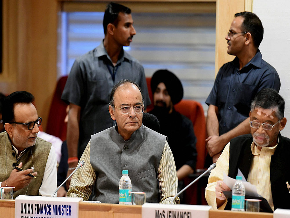 Union Minister for Finance and Corporate Affairs Arun Jaitley with Minister of State for Finance Santosh Gangwar at GST Council Meeting, at Vigyan Bhawan in New Delhi on Saturday. PTI Photo
