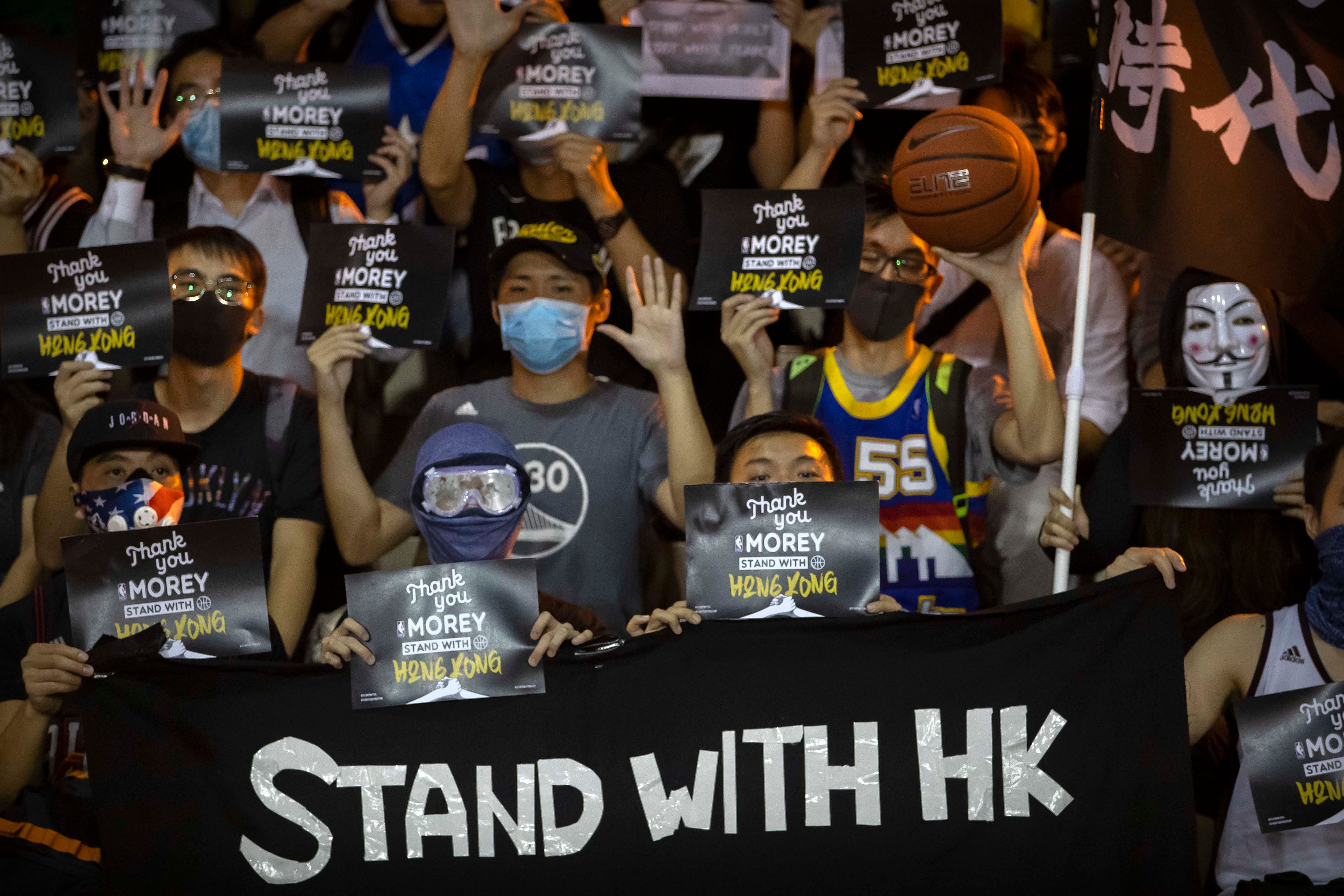 Demonstrators hold up signs in support of Houston Rockets general manager Daryl Morey during a rally at the Southorn Playground in Hong Kong. (AFP Photo)