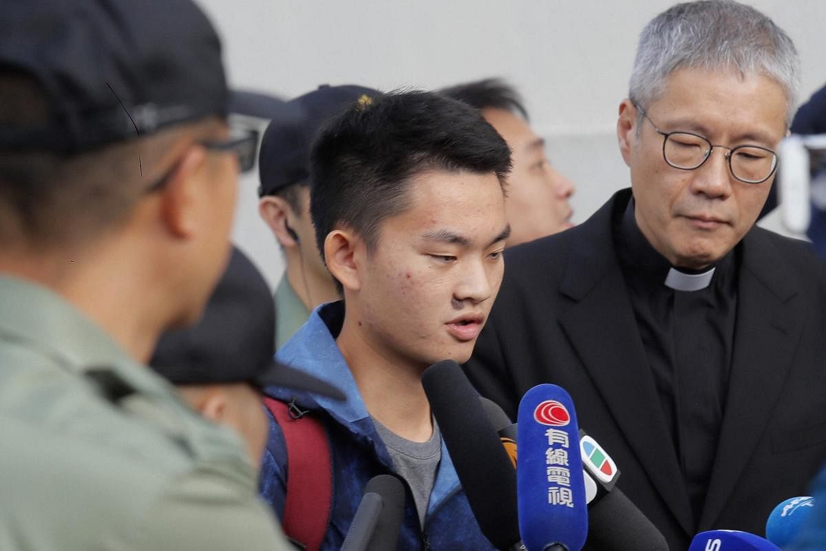 Chan Tong-kai, center, talks to the media as he is released from prison in Hong Kong Wednesday, Oct. 23, 2019. AP/PTI Photo