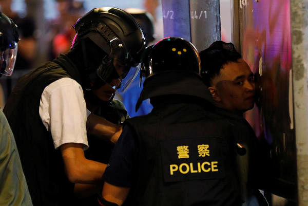The temporary injunction, uploaded on government websites overnight, was criticised by some on Saturday for its broad wording and for further shielding the identity of officers as they clash with protesters. Photo/Reuters