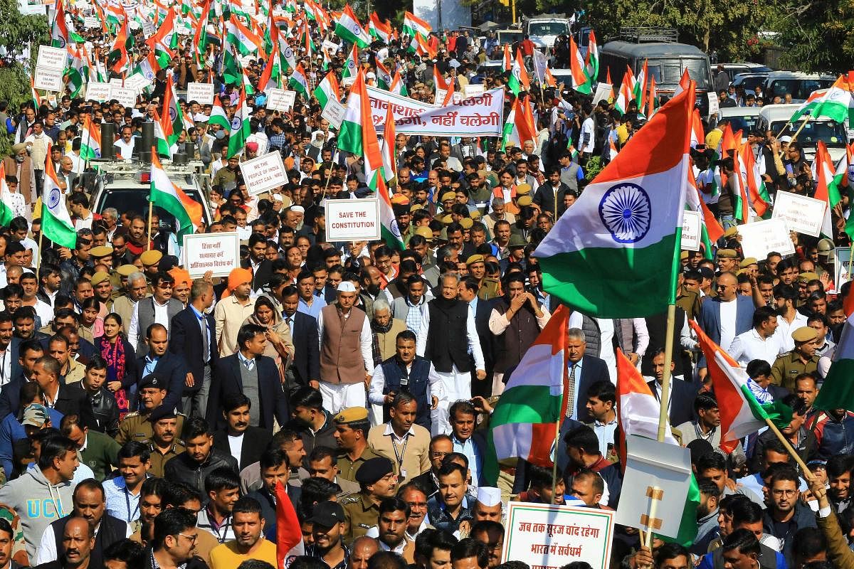 Rajasthan Chief Minister Ashok Gehlot (C) along with congress party leaders, workers and supporting parties takes part in a march against India's new citizenship law in Jaipur. AFP