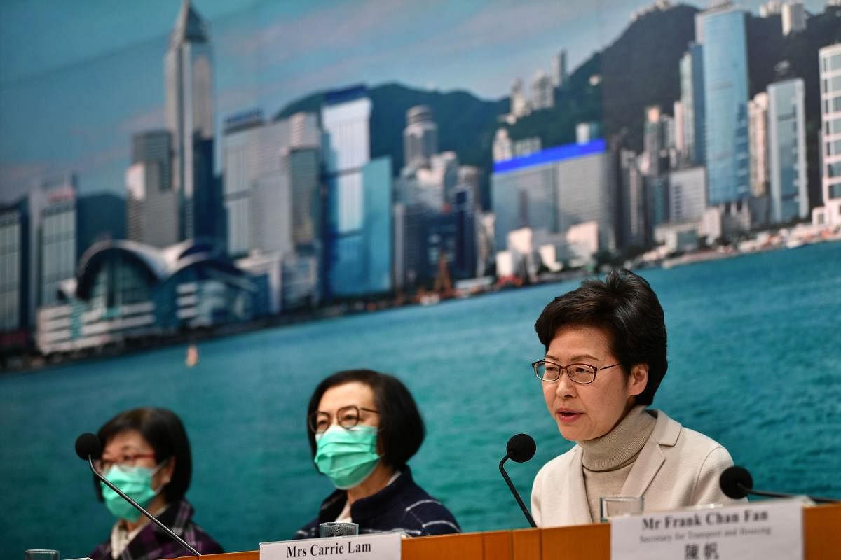 Hong Kong's Chief Executive Carrie Lam (R) speaks during a press conference in Hong Kong on February 3, 2020. AFP
