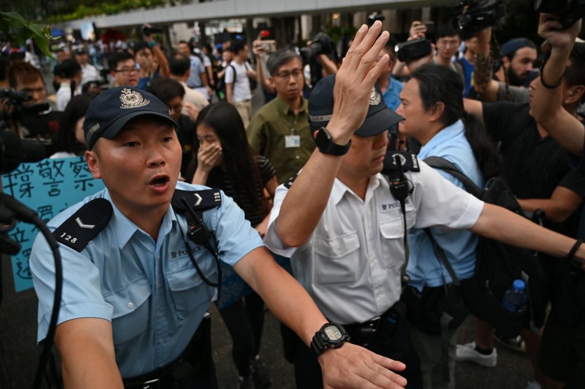 Hong Kong police on June 22 slammed anti-government protesters for besieging their headquarters, calling the demonstration "illegal and irrational" as they vowed to pursue the ringleaders. (AFP Photo)
