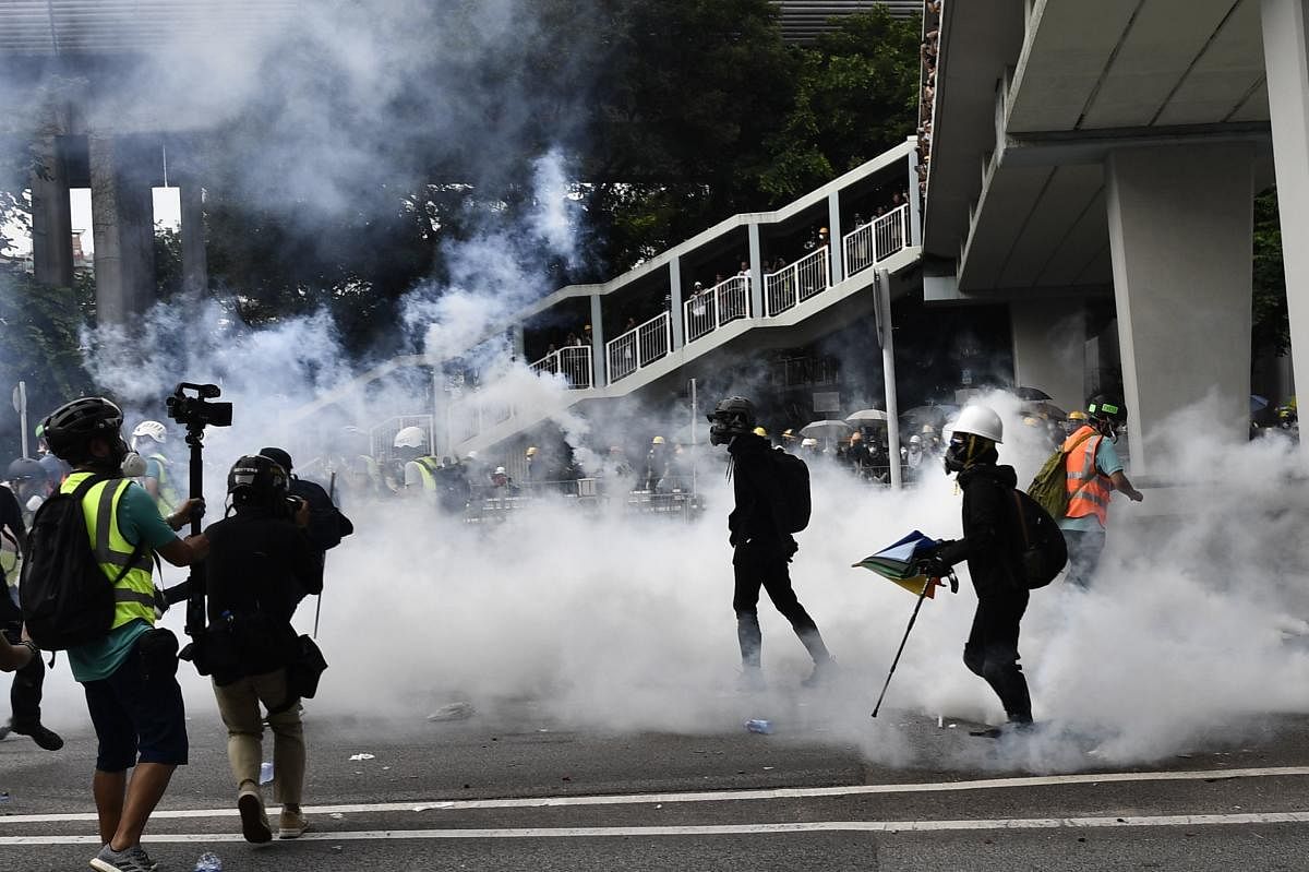 Hong Kong police fire tear gas during demonstration in the district of Yuen Long in Hong Kong on July 27, 2019. Photo credit: AFP