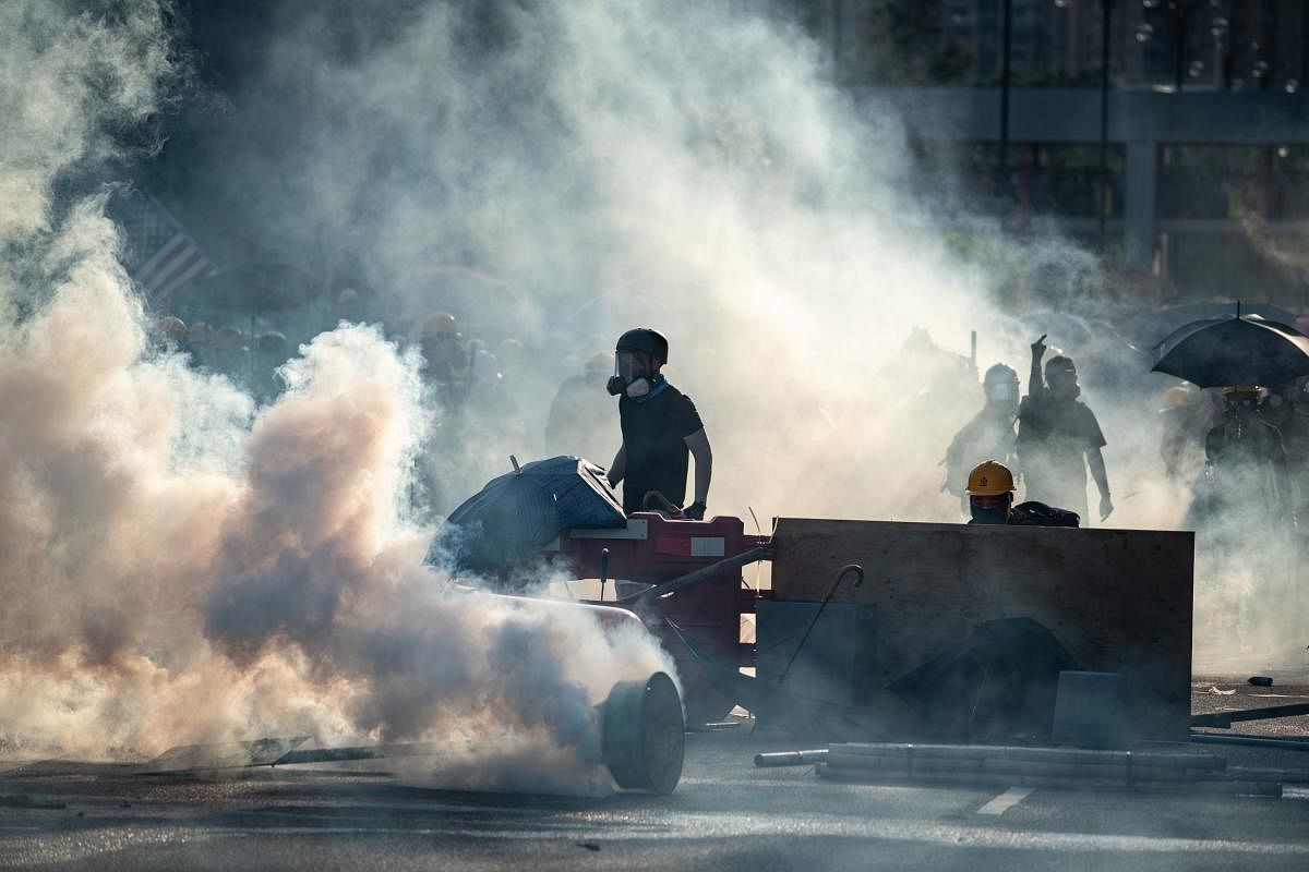 The past fortnight has seen a surge in violence on both sides of the protests, with police repeatedly firing rubber bullets and tear gas to disperse increasingly hostile projectile-throwing crowds. (AFP Photo)