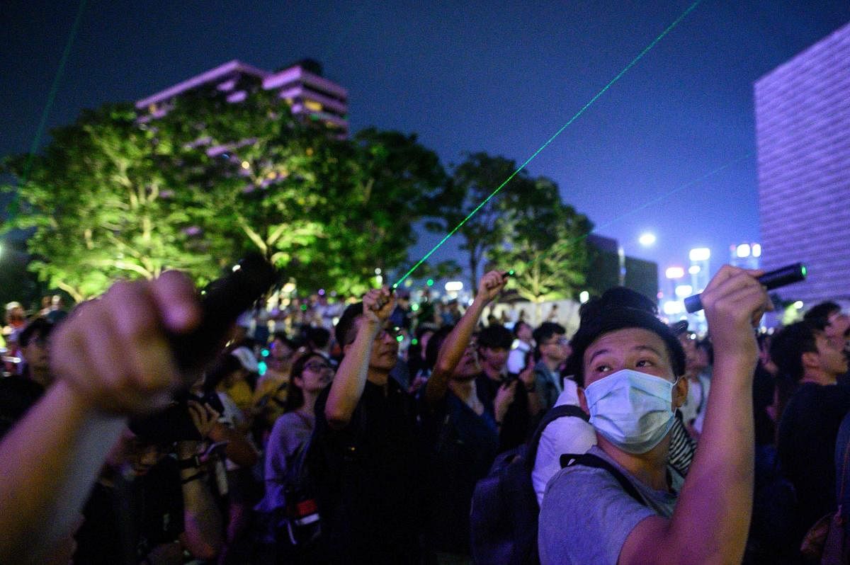 Protesters point lasers at the Space Museum during a demonstration in Hong Kong on August 7, 2019, in the latest opposition to a planned extradition law that has quickly evolved into a wider movement for democratic reforms. (Photo AFP)