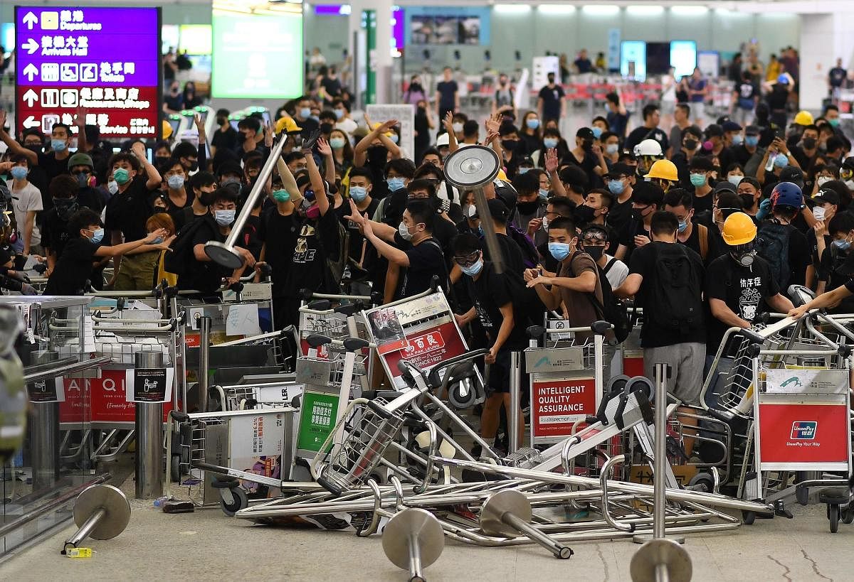 Pro-democracy protestors block the entrance to the airport terminals after a scuffle with police at Hong Kong's international airport. AFP photo