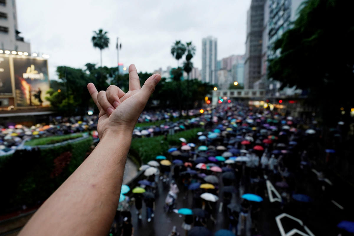 Anti-extradition bill protesters march to demand democracy and political reforms, in Hong Kong, China August 18, 2019. (Photo by REUTERS)