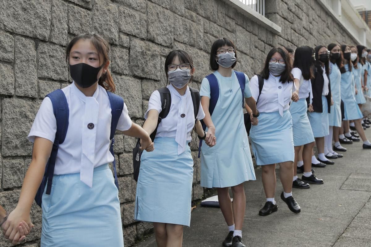Students form human chain outside the Maryknoll Convent School in Hong Kong (PTI Photo)